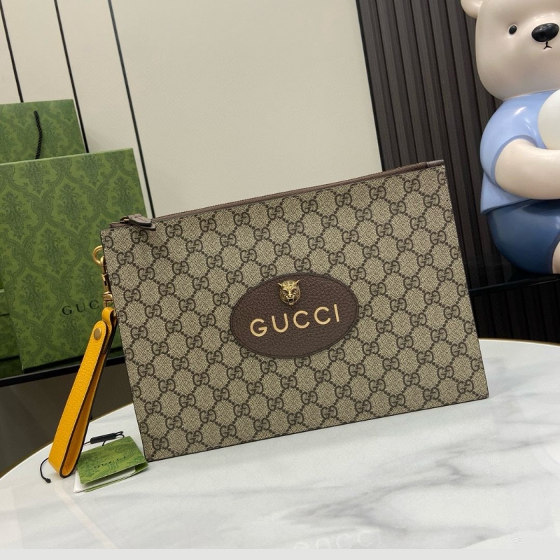 G*u*i clutch bags